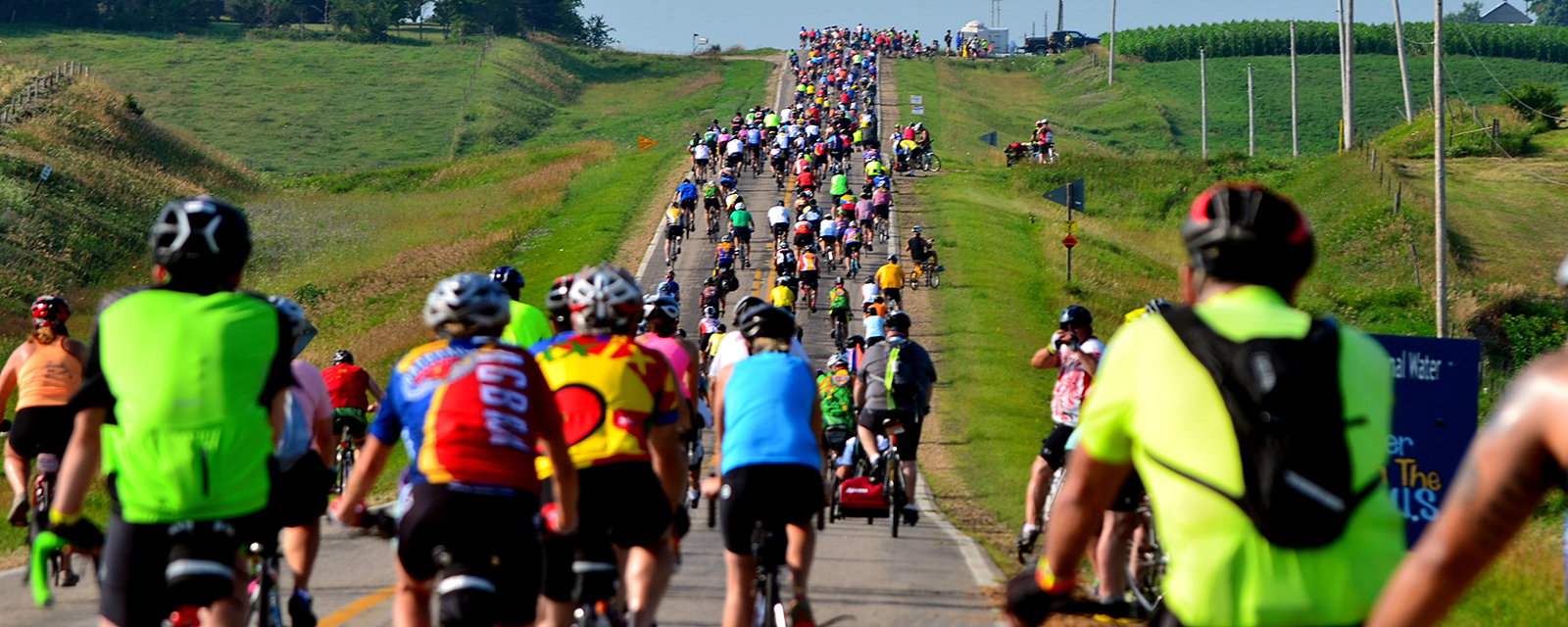 Cyclists climb a hill during the RAGBRAI Cyclists climb uphill during a non-competitive bicycle ride in Iowa