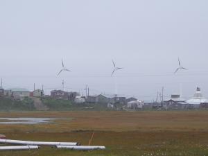Hooper Bay, Alaska with wind turbines and homes in the background