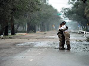 Photo of pararescueman Staff Sgt. Lopaka Mounts receiving a hug from a resident after Hurricane Ike, Sept. 13, 2008. Photo of pararescueman Staff Sgt. Lopaka Mounts receiving a hug from a resident after Hurricane Ike, Sept. 13, 2008.