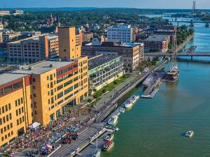Green Bay's CityDeck with the Peacemaker tall ship docked at the Cherry Street boat landing.