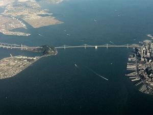 Aerial view of the San Francisco Bay with the Bay Bridge in foreground.