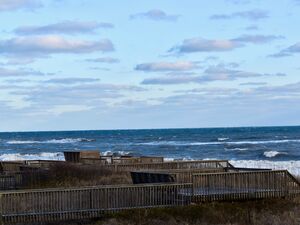 A view of the sea from the dock behind the dunes.