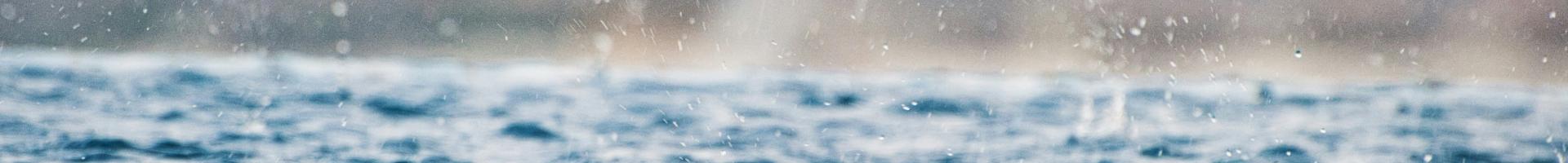 closeup-photography-of-water-drops-on-body-of-water