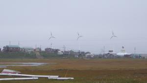 Hooper Bay, Alaska with wind turbines and homes in the background