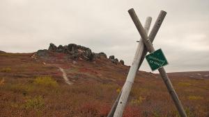 village marker and rock formation