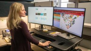 scientist working with GIS on computer