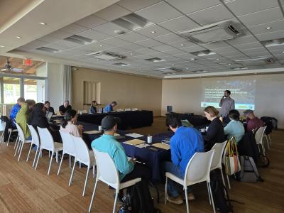 The photo shows participants working on skills prioritization exercises to implement NbS