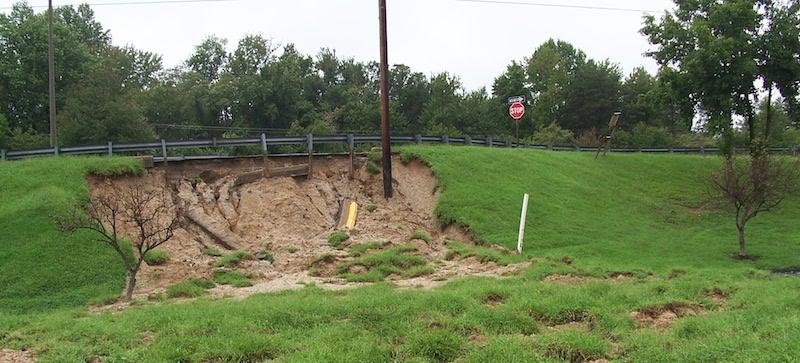 Photo of erosion at edge of raised road