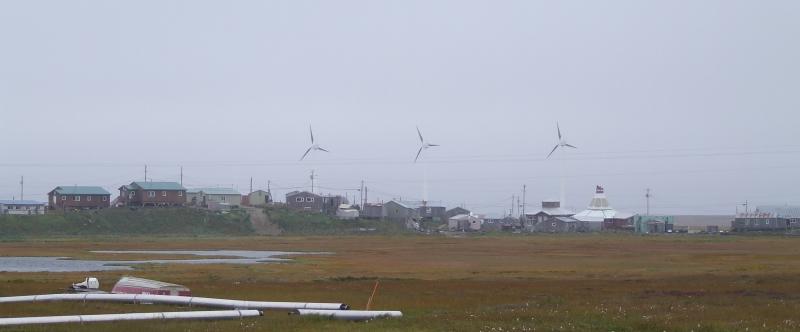 Hooper Bay, Alaska with wind turbines and homes in the background