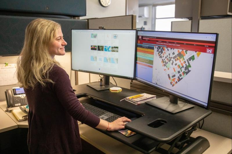 scientist working with GIS on computer