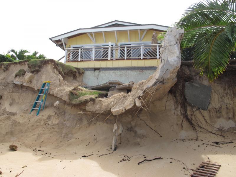Eroding cliff below a former beachfront house