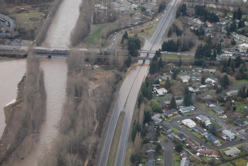 A flooded highway next to a river