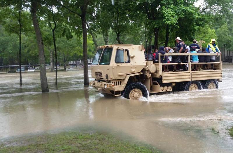 Photo of Texas Guardsmen in a truck after severe flooding in Houston