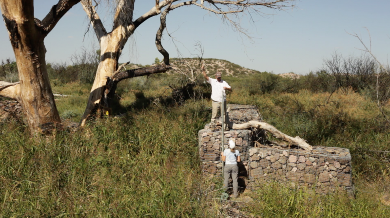 Photo of volunteers building erosion control structures