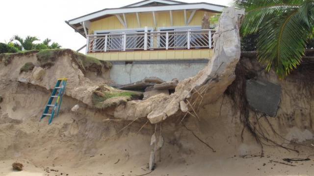 Eroding cliff below a former beachfront house