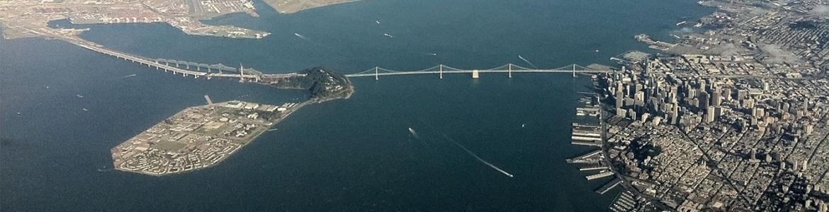 Aerial view of the San Francisco Bay with the Bay Bridge in foreground.